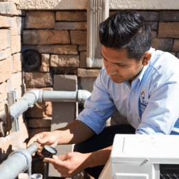 HVAC tech testing pipes