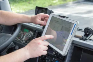 Booster service person updating tablet