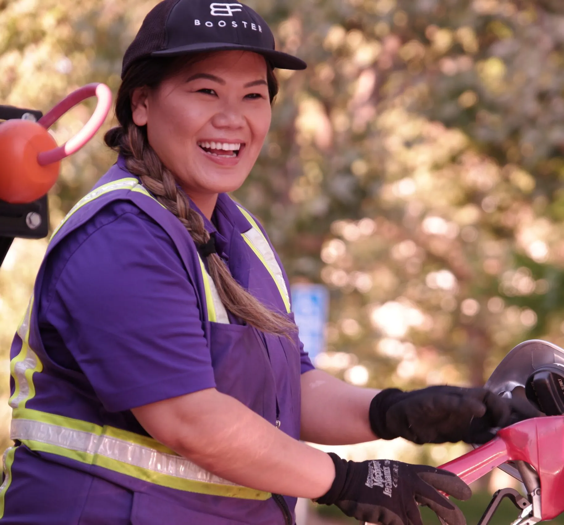 Pacific Asian Booster service professional woman fueling car