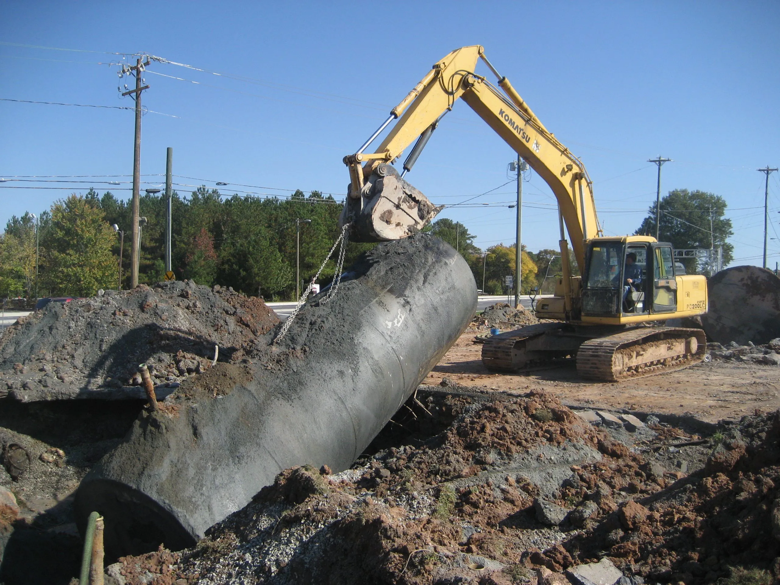 crane removing underground storage tank